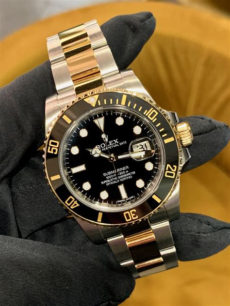 gold and stainless rolex submariner.